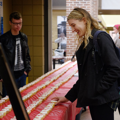 Students enjoy cupcakes iced with the digits of pi at a Pi Day celebration hosted by the Society of Physics Students.(Photo by Kristi Woody)